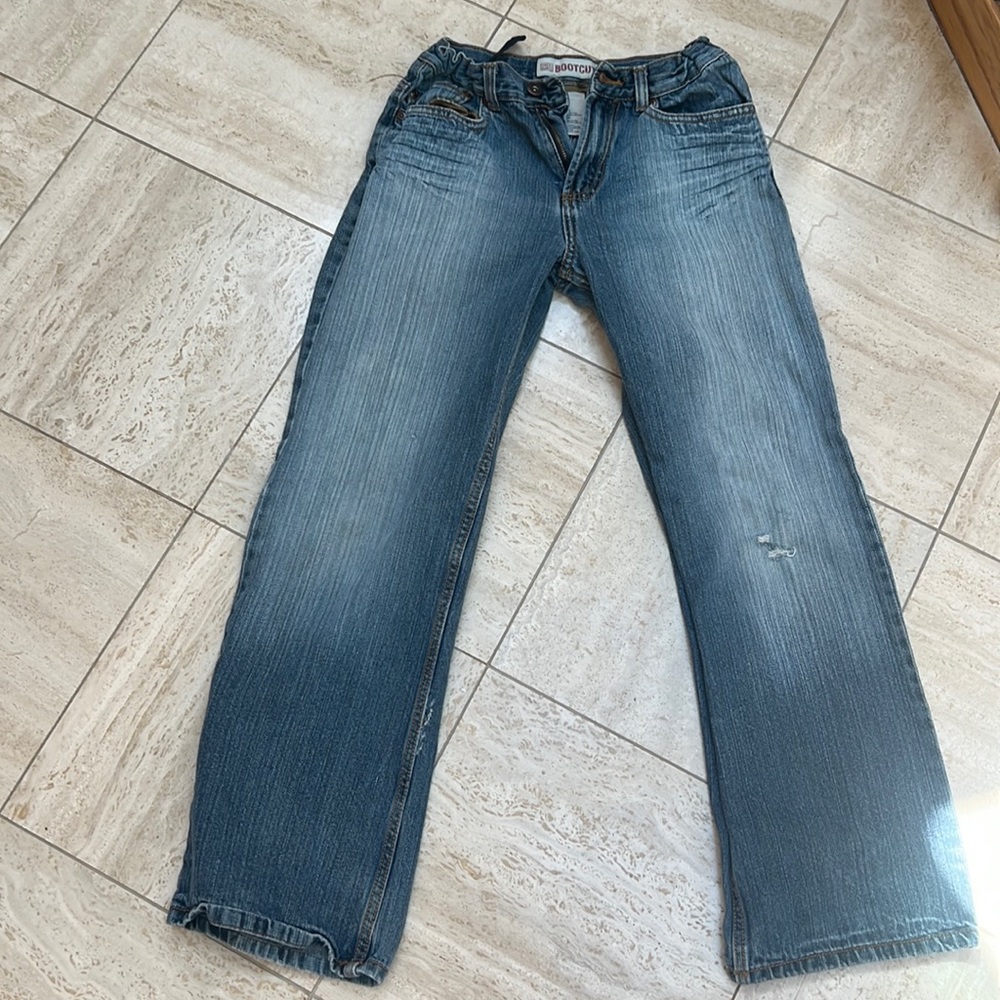 Bootcut ripped jeans from faded glory , never worn, 2 stains size M